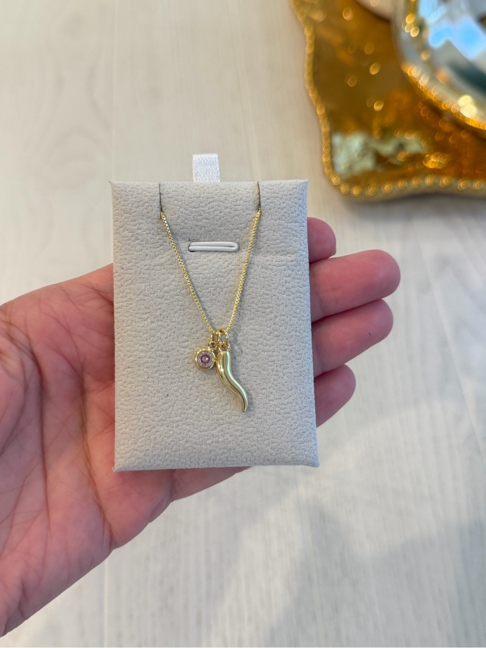Gold-Tone Horn Pendant Necklace with Pink Charm